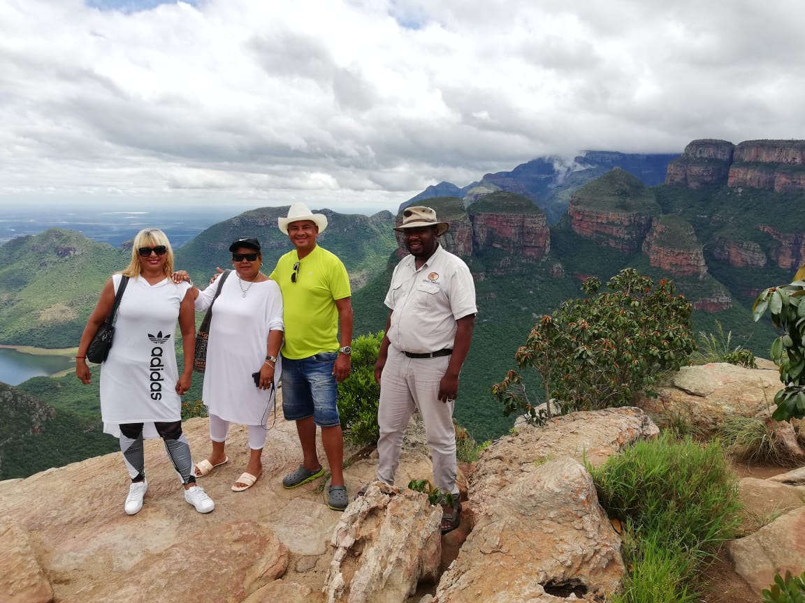 Guests posing above the Blyde River Canyon